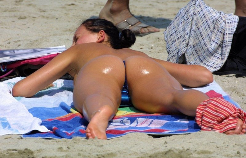 Tanned butt in thongs