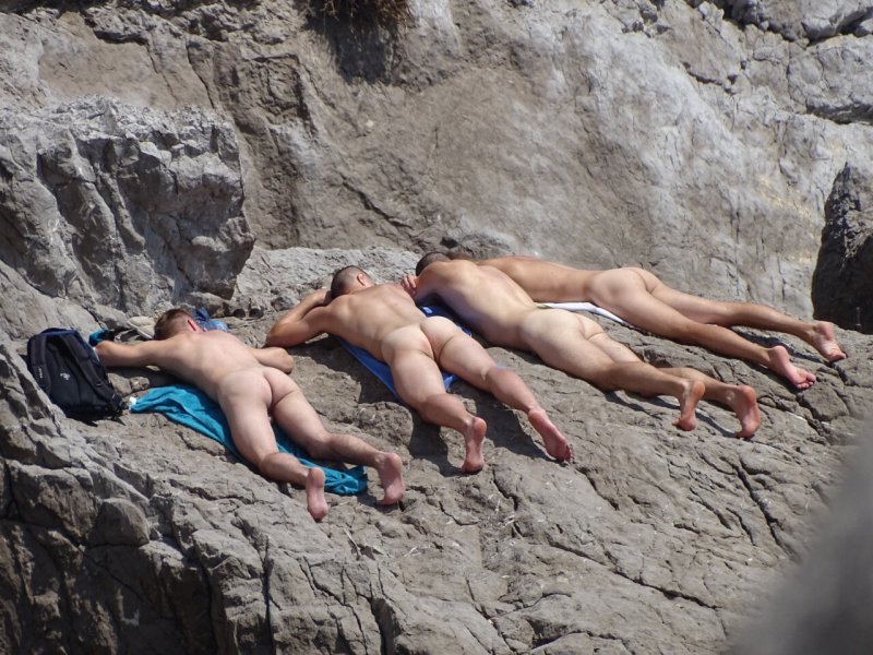 Men on a nudist beach