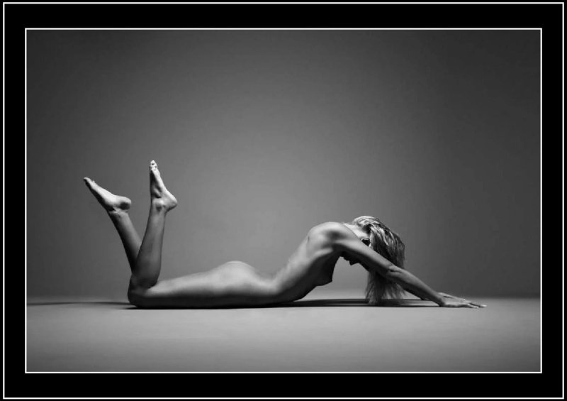 Poses for a photo shoot in the style of nude