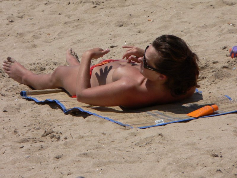 Penelope Cruz sunbathes topless