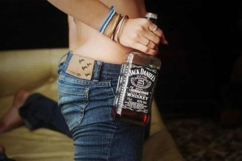 Girl with a bottle of whiskey