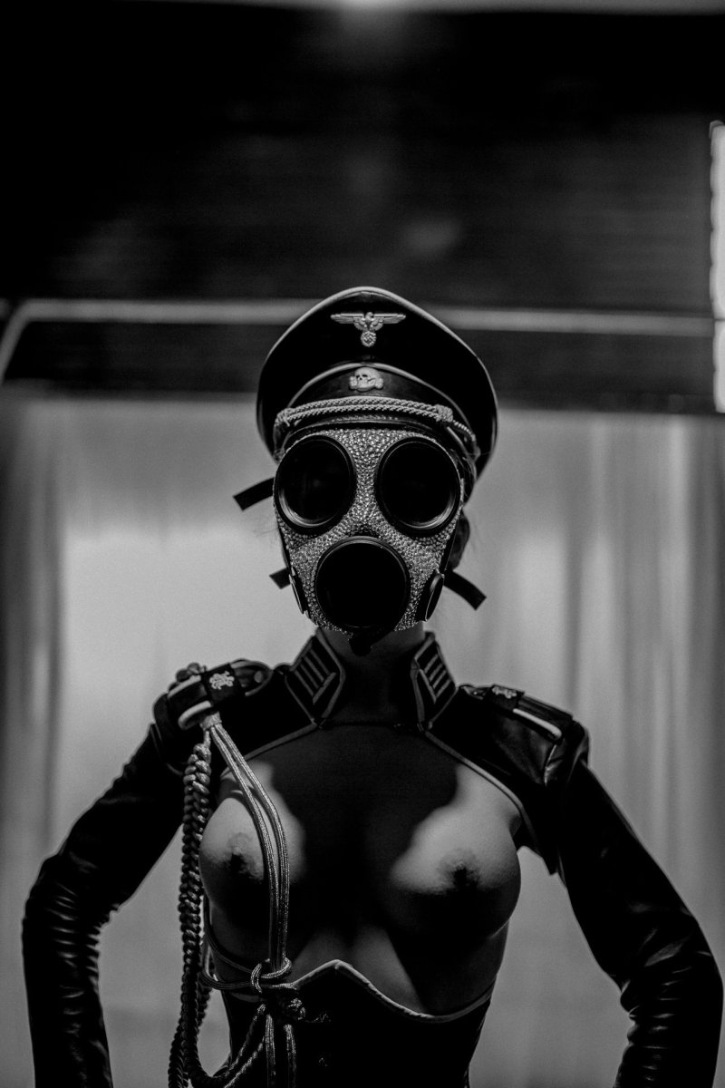 Naked woman in a gas mask