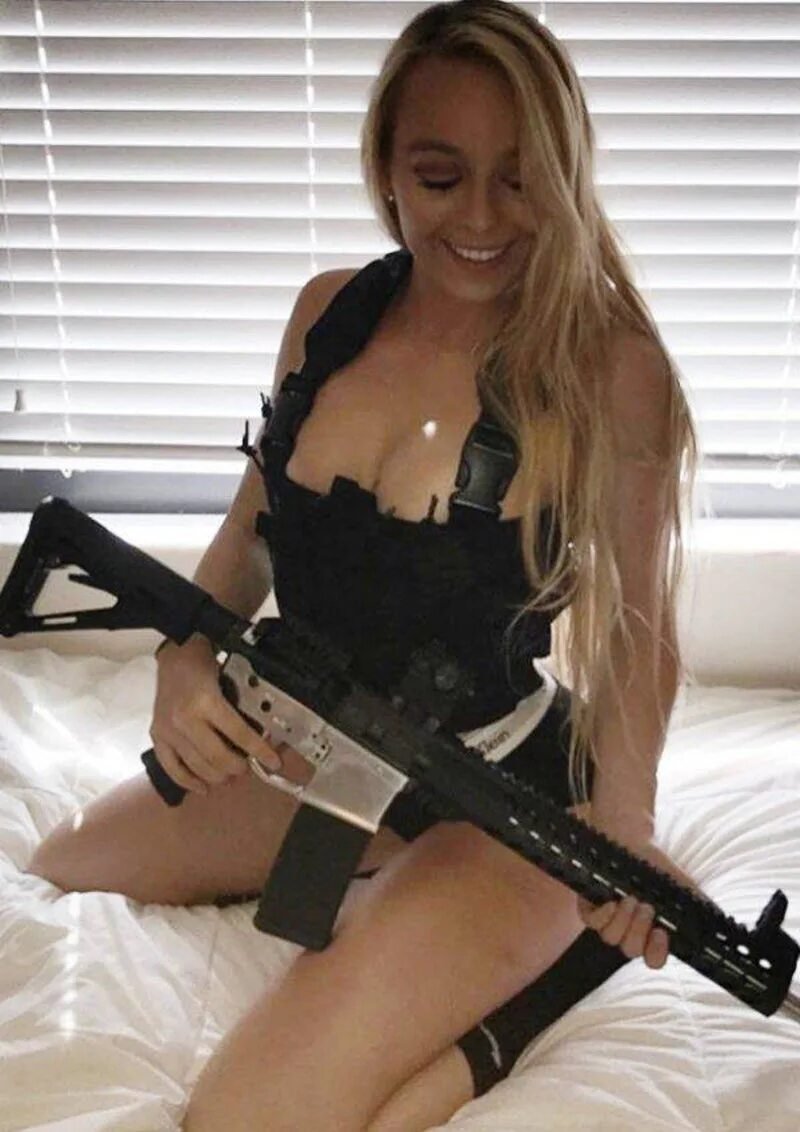 Beautiful girls with weapons