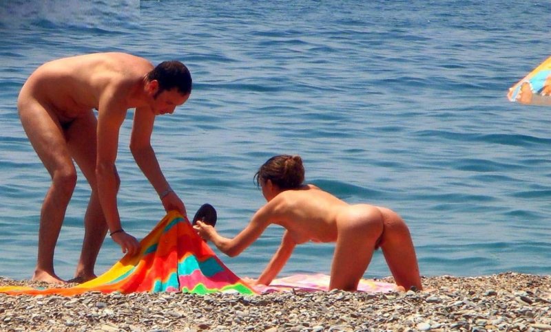 On a nudist beach