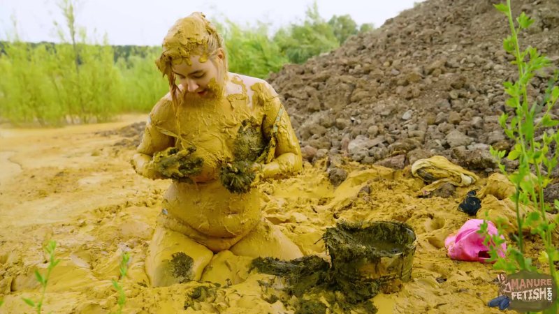 Women swim in the mud